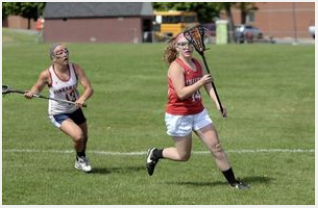 Amanda hustles with the ball while looking for an open teammate.